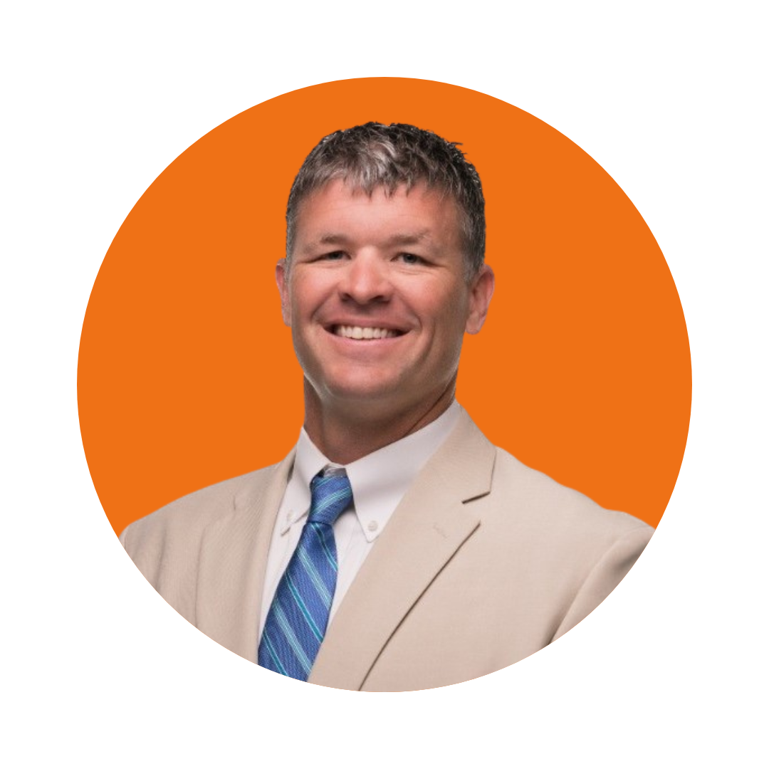 A person in a suit and tieDescription automatically generated